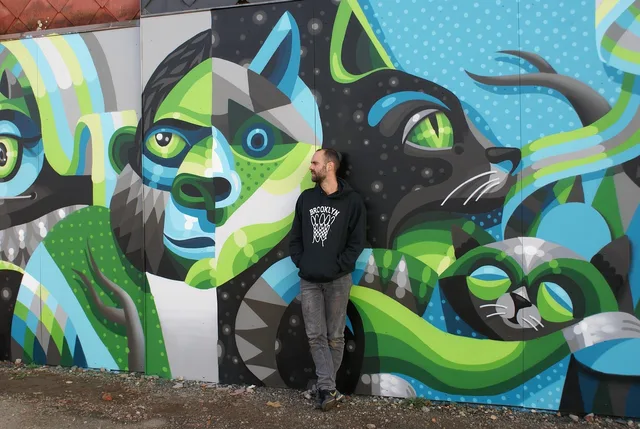 street art, hasselt, mural, artist, man, wall art, painting surface-mounted loudspeakers, graffiti, street art, street art, street art, street art, street art, mural, mural, mural, wall art, graffiti, graffiti, graffiti. Fictional case: correcting a collaborative mural credit