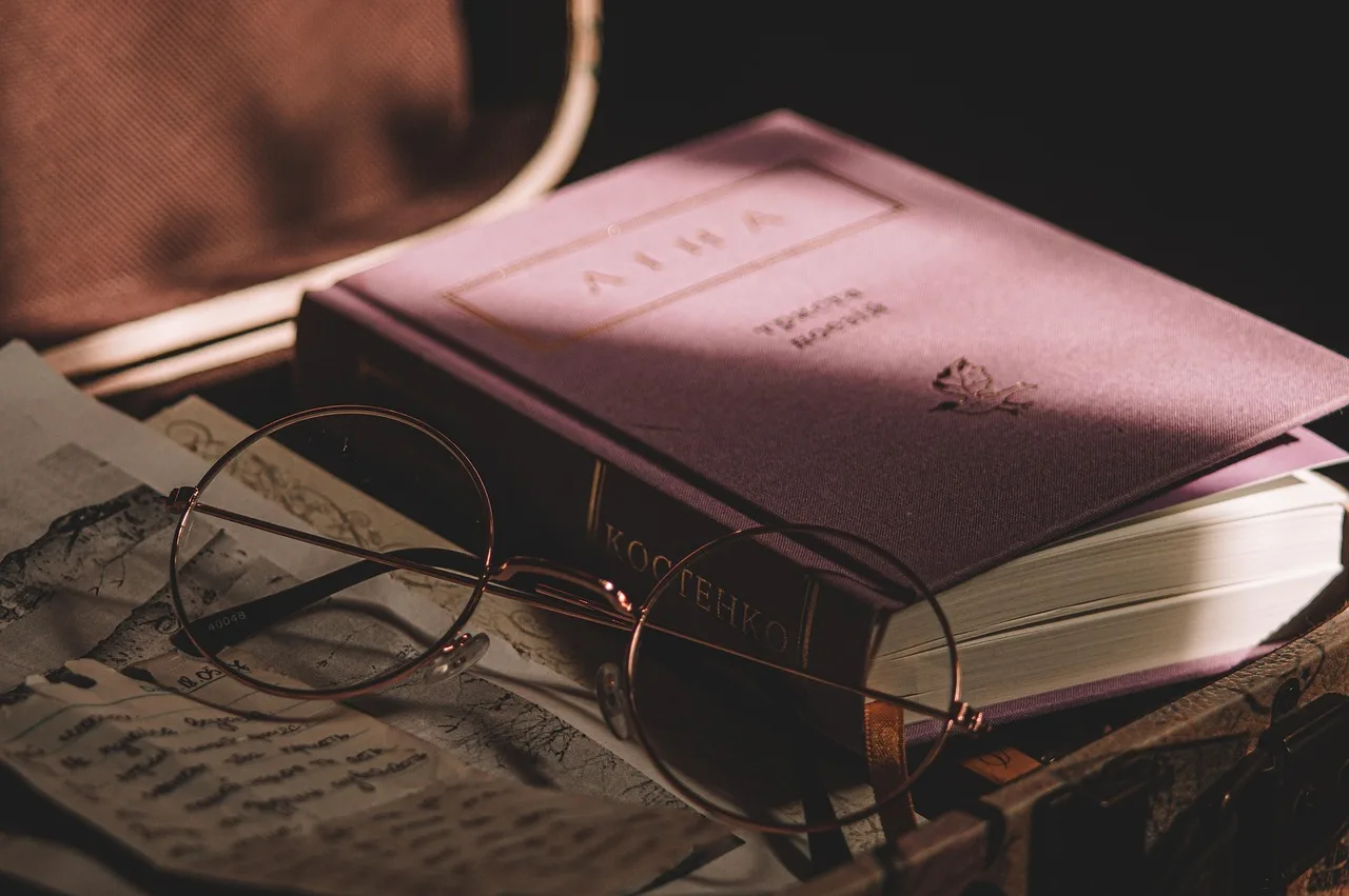 book, glasses, newspaper, retro. Literary coverage forms: common mistakes and fixes